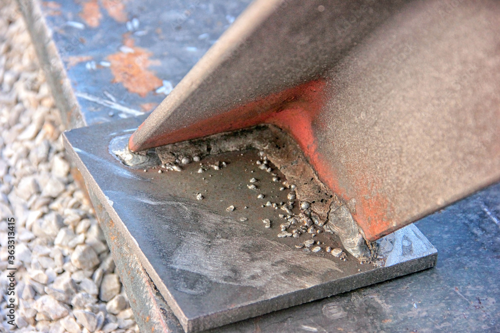 Welding slag. Welding slag is a form of slag or vitreous material produced as a by product of