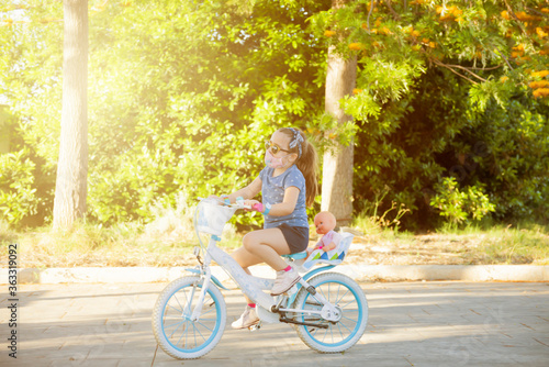GIRL RIDING A BIKE WITH THE MASK ON