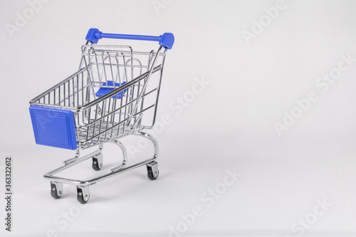 Shopping cart with blue elements on a white background.