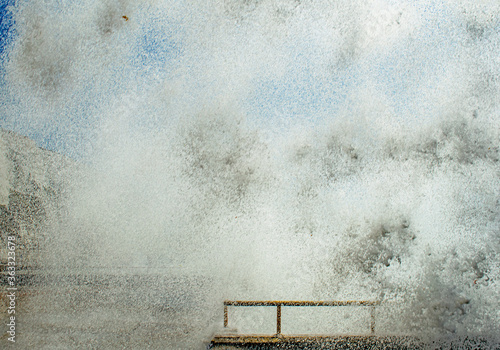 A close up of a Whitout wave at the stormy seafront in Rottingdean,England ,completely covers the view