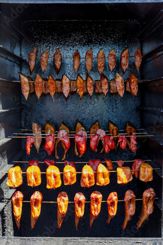 freshly smoked fish in smoking oven © Björn Wylezich