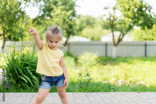 Little girl dances in the country