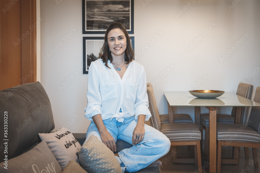 young brazilian woman smiling and relaxing at home young brazilian woman smiling and relaxing at home