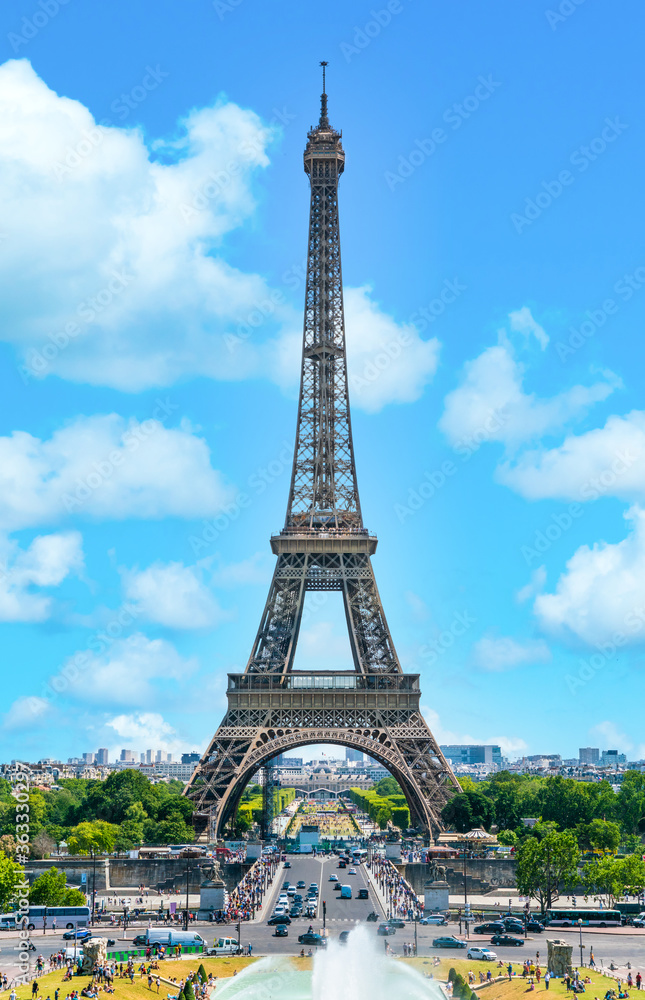 Fototapeta premium Paris, France - July 3th 2019 - Tourists visiting the Eiffel tower (Tour de Eiffel) on a sunny day