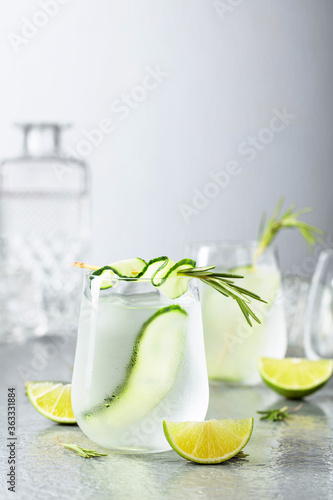 Detox drink or green iced refreshing lemonade with rosemary, cucumber and lime.