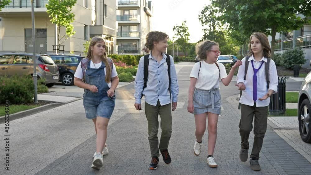Classmates on the way from school. School friendship. Back to school. Classmates on the way from school. School friendship. Back to school.