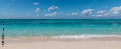 Panoramic view of tropical white sand beach and sea of ​​the Cayman Islands.