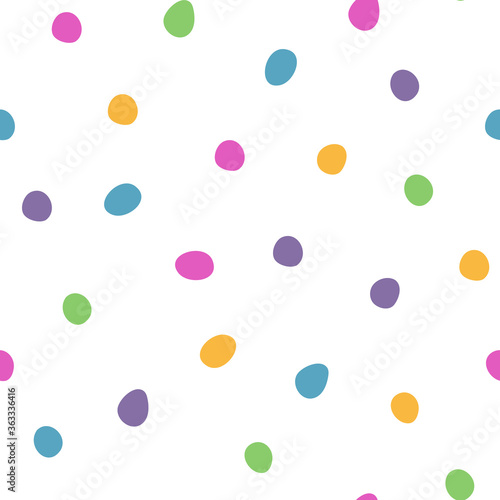 Seamless pattern with multi-colored confetti. Vector abstract pattern on a white background. Modern pattern with polka dots. For the design of textiles, wrapping paper, wallpaper.