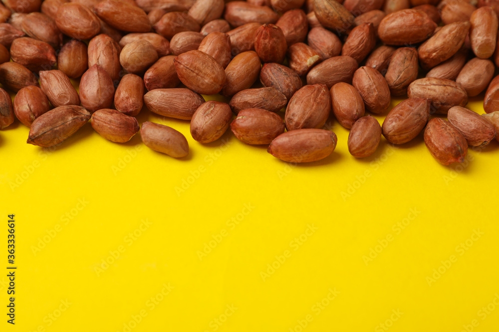 Tasty peanut on yellow background, space for text. Vitamin food Tasty peanut on yellow background, space for text. Vitamin food