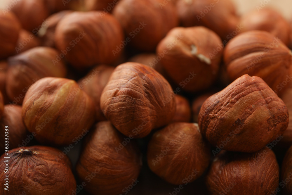 Tasty hazelnuts on whole background, close up. Vitamin food Tasty hazelnuts on whole background, close up. Vitamin food
