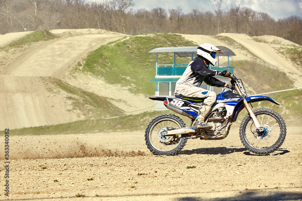 Motocross concept, a biker goes off-road making extreme skiing. In pursuit of adrinalin, sport concept. Dangerous sport. Motocross concept, a biker goes off-road making extreme skiing. In pursuit of adrinalin, sport concept. Dangerous sport.