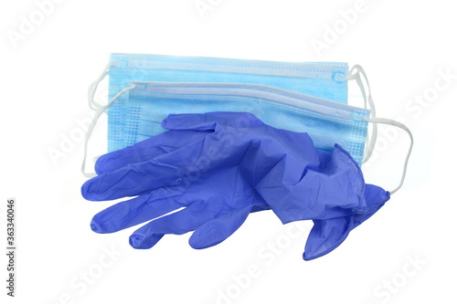 A pair of thin blue medical latex gloves and face shield on a white background. Disposable rubber medical gloves and mask. Protective subjects. Remedies.