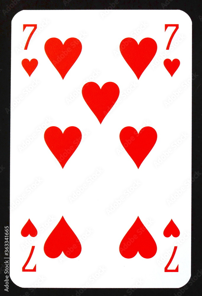 Seven of hearts playing card isolated on black. Seven of hearts playing card isolated on black.