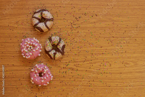 Colored donuts with chocolate shavings