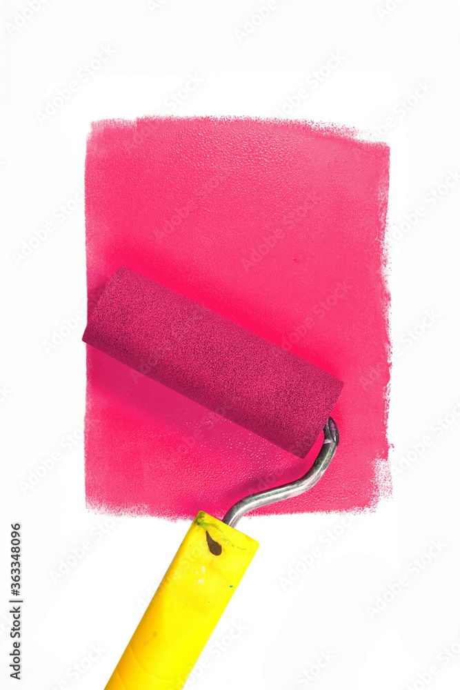Obraz premium Painting a rough wall with roller. Paint roller leaving stroke of white color over a rustic background. usable for text and messages.