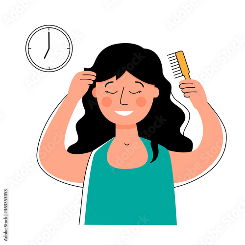 Woman combing her hair with a comb. Morning routine. 