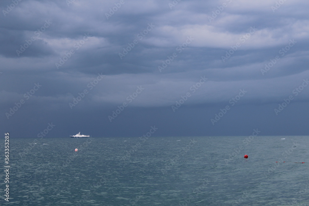 Boat in the sea stormy weather dark sky