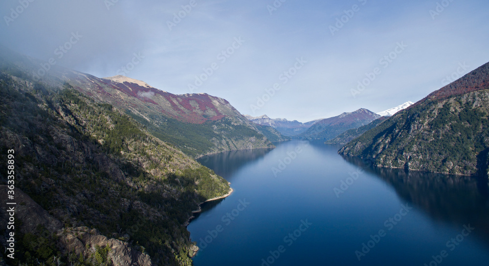 Aerial view of Nahuel Huapi lake in Bariloche, Patagonia Argentina. Pure water lake surrounded by cliffs, mountains and forest in autumn.