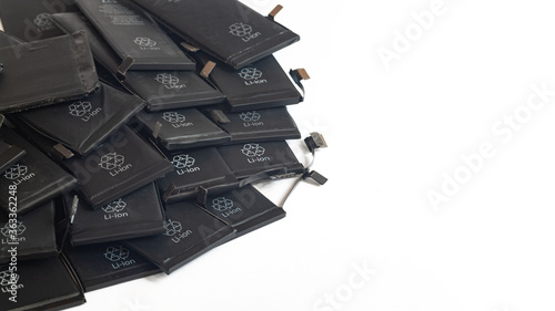 Close up of old used Li-ion polymer batteries of mobile phones preparation for recycling. Copy space.
