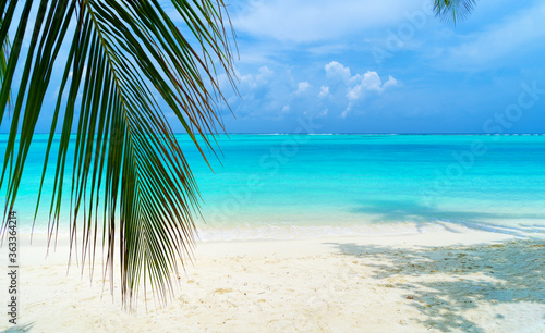 Lounge chairs on a beautiful tropical beach at Maldives © lotosfoto