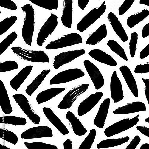 Brush strokes vector seamless pattern. Black paint freehand scribbles, dash lines, dry texture. Chaotic rough smears. Black and white mosaic texture. Hand drawn grunge ink brushstrokes.