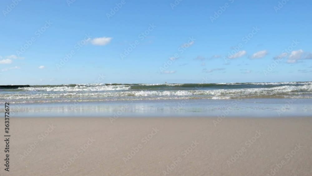 Baltic sea seascape. Sandy beach in summer. Low angle view. Baltic sea seascape. Sandy beach in summer. Low angle view.