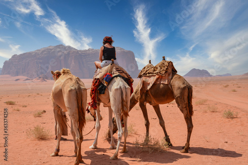 Female tourist riding a camel in the Wadi Rum desert  © Pierre vincent