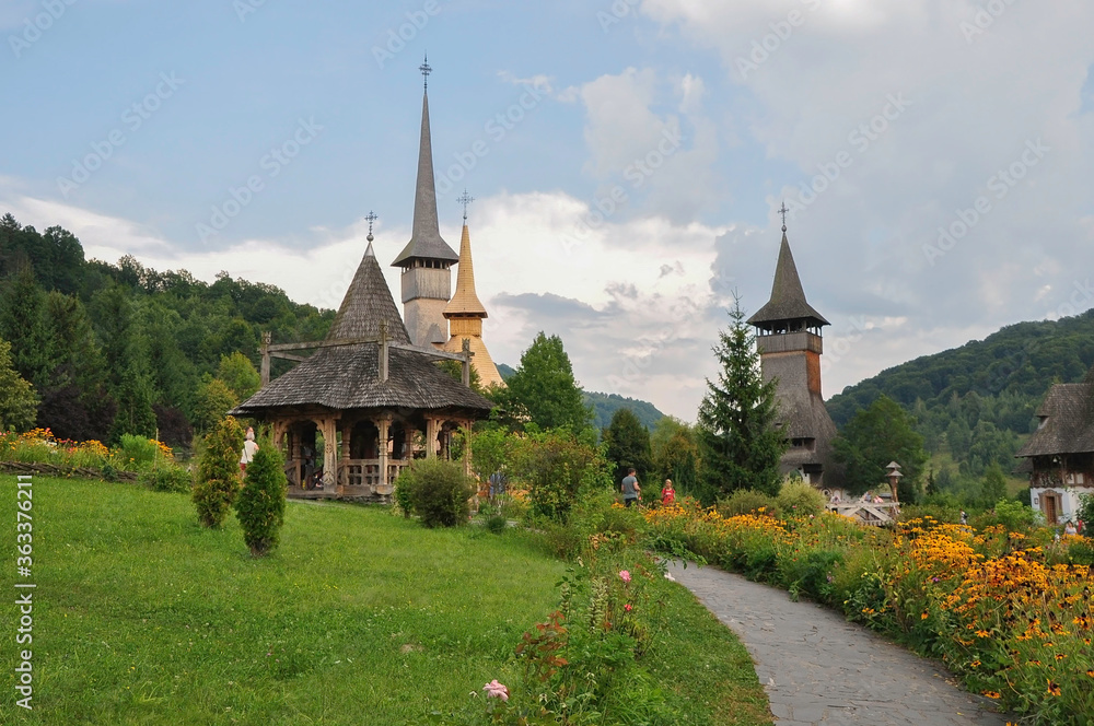 Barsana Monastery, Maramures, Romania, Europe, spring 2018. Beautiful garden with several churches of the Barsana Orthodox monastery. It is one of the main points of interest in the Maramures area.