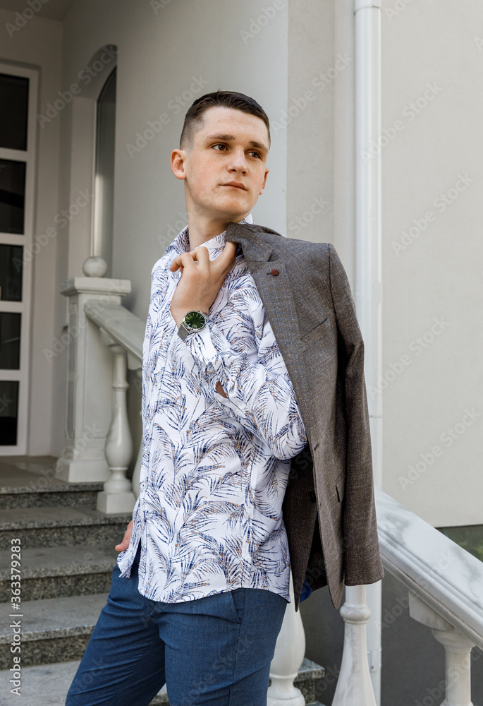 Fototapeta premium Portrait of an handsome businessman in an urban setting