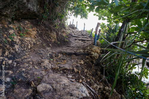 Stairs leading to top of hidden hill for great view at Batu Bengkung Beach Malang, East Java, Indonesia photo