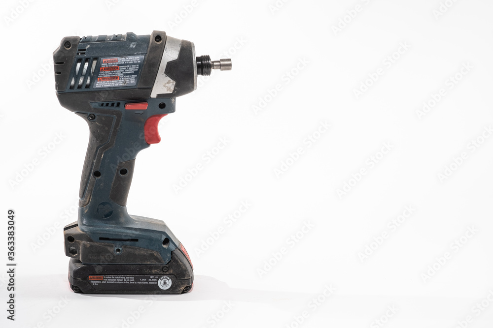 Impact Driver drill isolated on a white background with room for copy on the right Impact Driver drill isolated on a white background with room for copy on the right