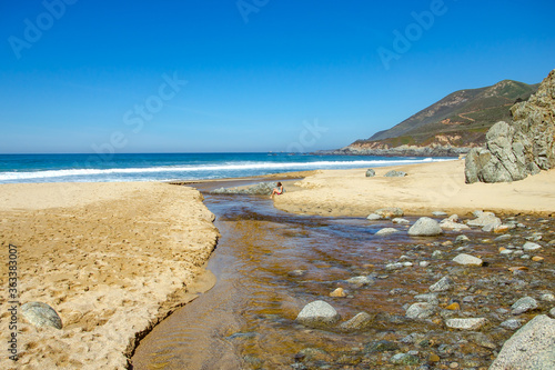 Creek flows into the ocean, Big Sur, California