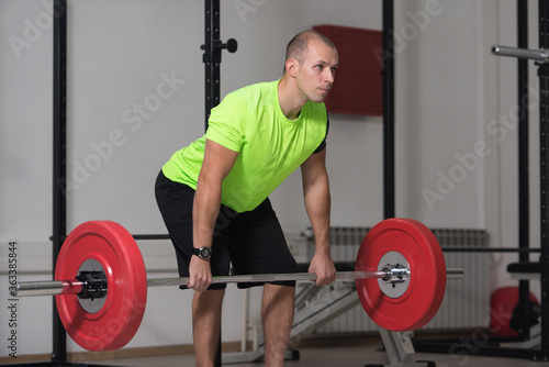 Back Exercise With Barbell In Fitness Center