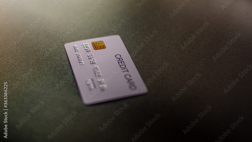Close-up Focus a credit card on black background, Detail Number, Chip Card, Texture Card, for Banner. Close-up Focus a credit card on black background, Detail Number, Chip Card, Texture Card, for Banner.