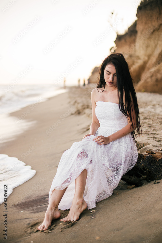beautiful young woman enjoying a day at the beach beautiful young woman enjoying a day at the beach