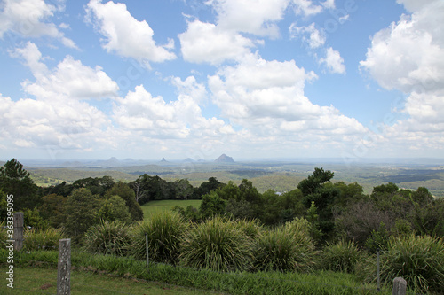 Glass House Mountains, Sunshine Coast, Queensland, Australia showing blue sky, mountains, paddocks, farming land and forests photo