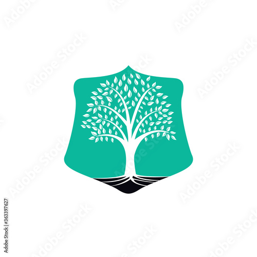 Tree Roots shield vector logo design. shield Vector tree with roots logo element.
