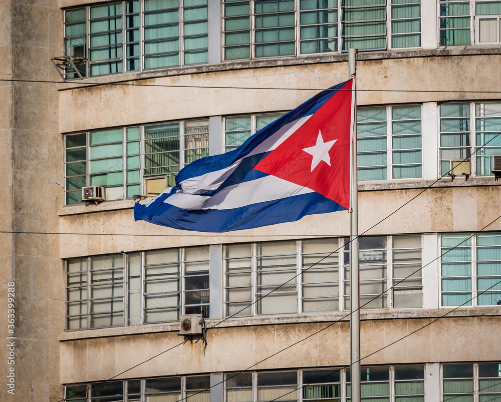 Cuban flag on a grunge decaying office building in 2015