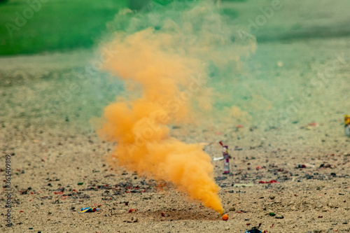 Orange smoke bomb