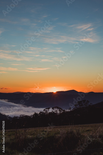 sunrise sky with beautiful clouds rolling over the hills of Tasmania