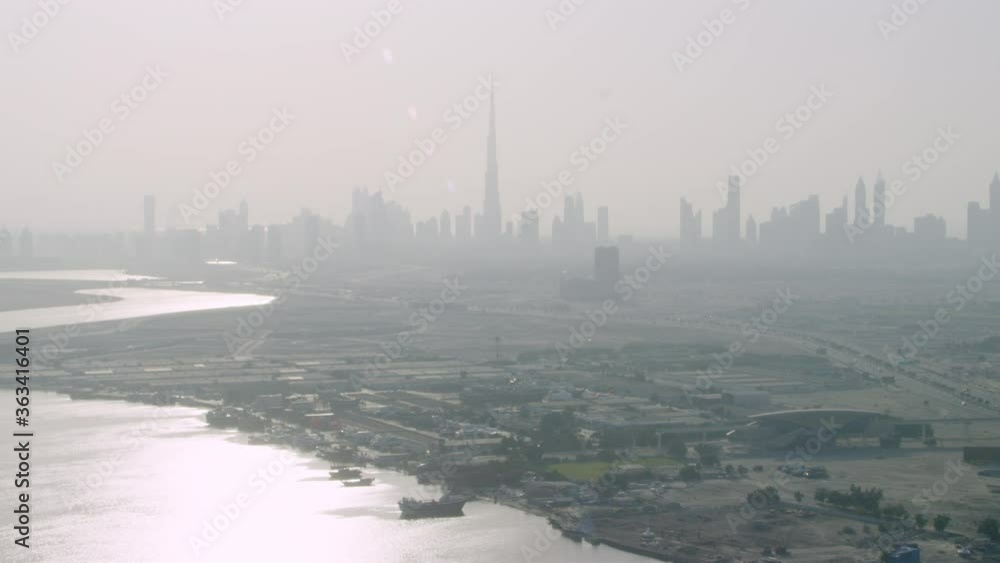 An amazing aerial silhouette view of Burj Khalifa with a beautiful Dubai skyline helicopter, 6-axis stabilized gimbal, Shotover,8K An amazing aerial silhouette view of Burj Khalifa with a beautiful Dubai skyline helicopter, 6-axis stabilized gimbal, Shotover,8K