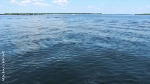 Beautiful Blue Sky Over The Calm Water Of Kawartha Lakes In Ontario, Canada.  - wide shot photo