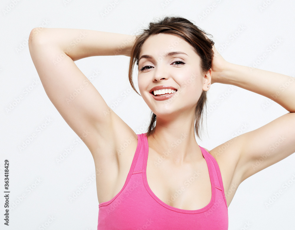 sport and people concept: Cheerful attractive young fitness woman in top and black leggings sport and people concept: Cheerful attractive young fitness woman in top and black leggings