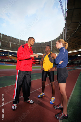 Sports coach giving instruction