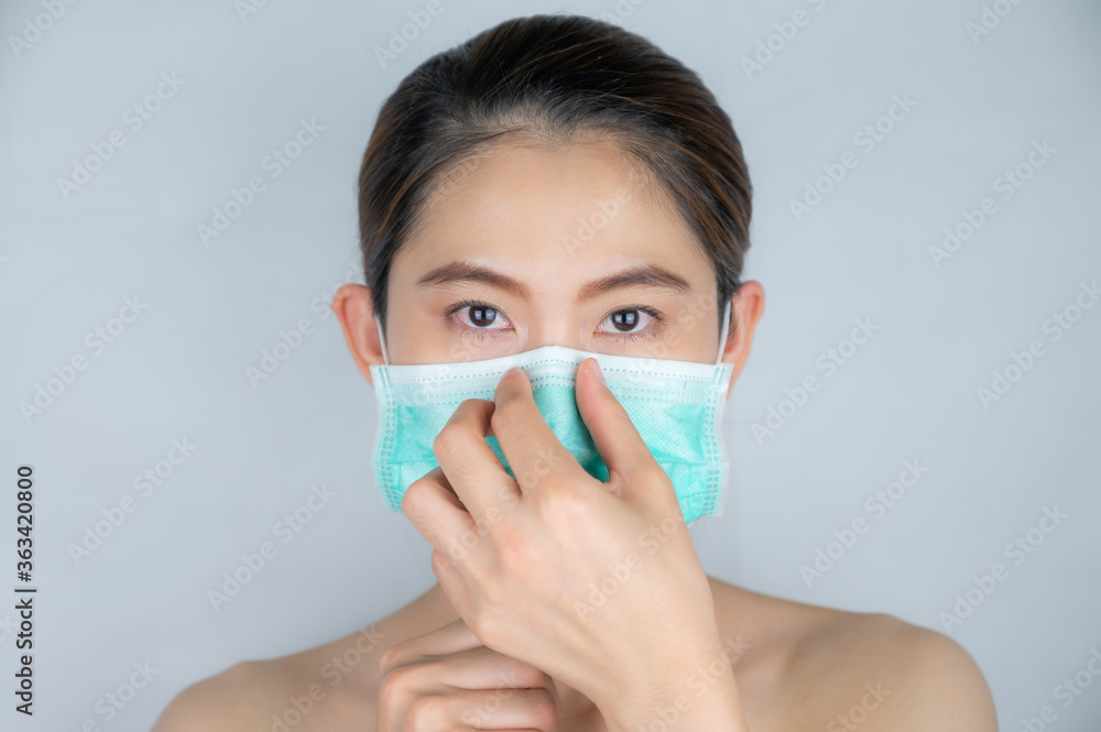 Asian woman wearing surgical mask for protect bad air pollution of virus disease. Asian woman wearing surgical mask for protect bad air pollution of virus disease.