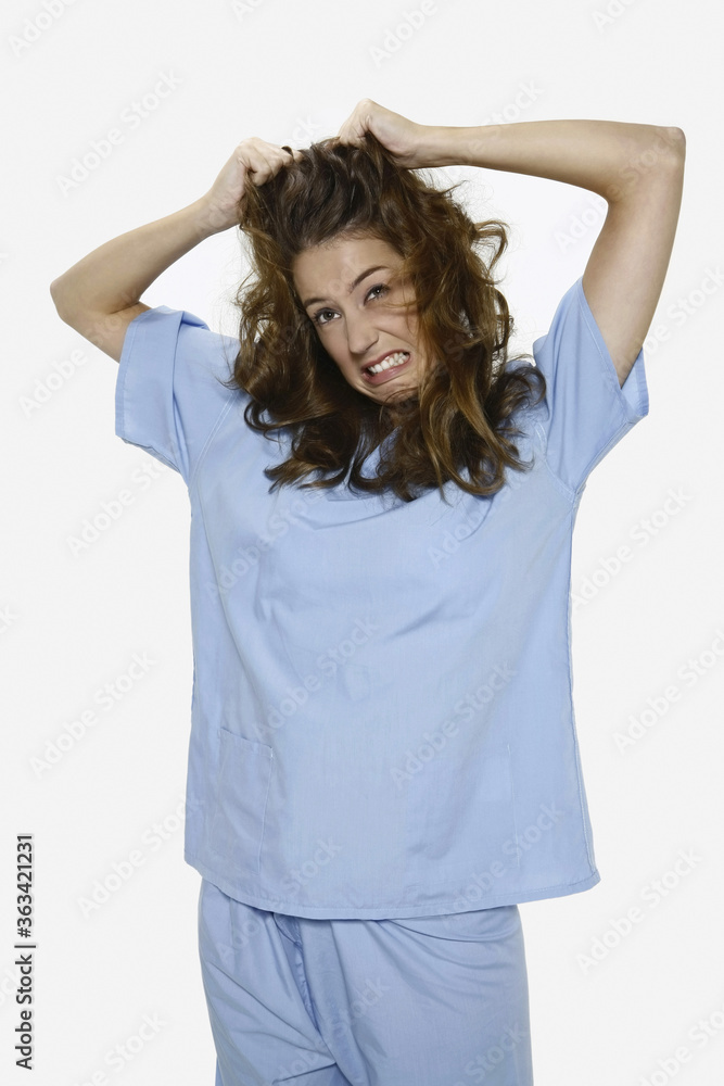 Woman pulling her hair Woman pulling her hair