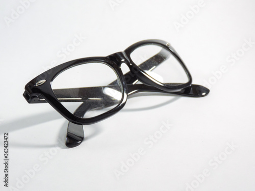 Fototapeta Naklejka Na Ścianę i Meble -  black nerdy glasses on white background