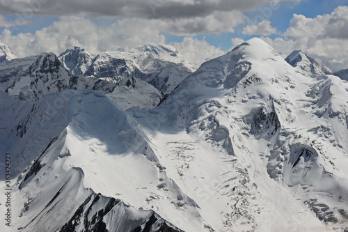 Khan Tengri peak and the Tien Shan ridges on the border of three countries: Kazakhstan, Kyrgyzstan and China. © Vladimir