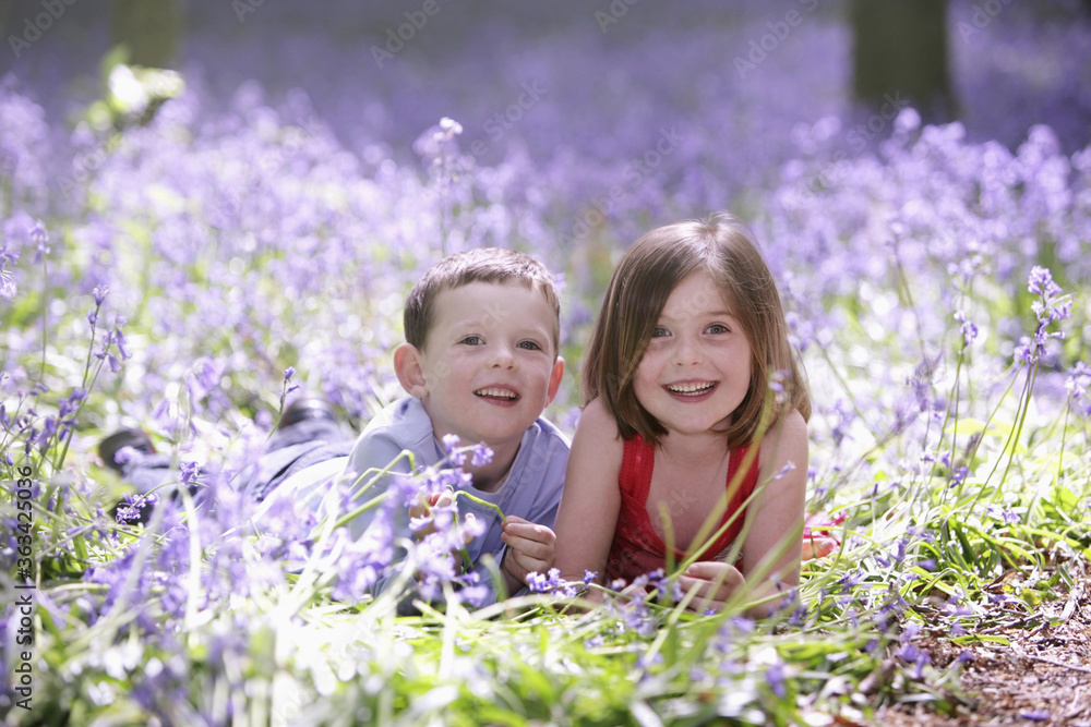 Boy and girl in field of flowers Boy and girl in field of flowers