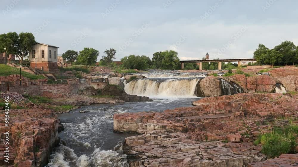 Looping, Waterfalls in Falls Park, a major tourist attraction in Sioux Falls SD Looping, Waterfalls in Falls Park, a major tourist attraction in Sioux Falls SD